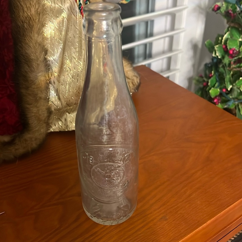 Old Dr Pepper embossed. Good for life on one side. 10 2 4 on other side